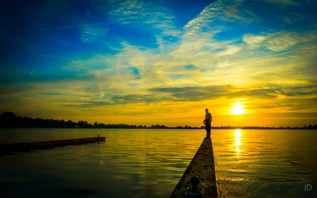 A fisherman and golden light at the Noord-AA