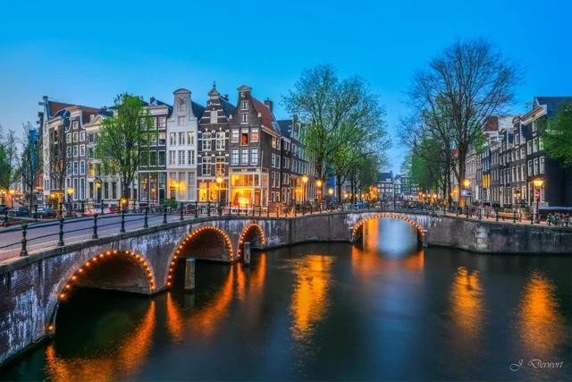 Amsterdam at night: canal bridges and the Damrak