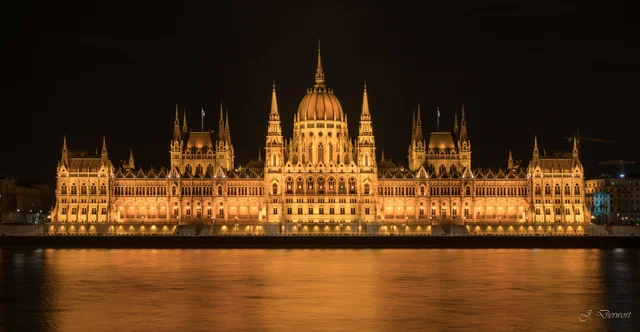 Budapest Parliament at night: golden reflections on the Danube